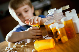 Child opening prescription pill bottles