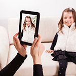 Mother taking picture of child